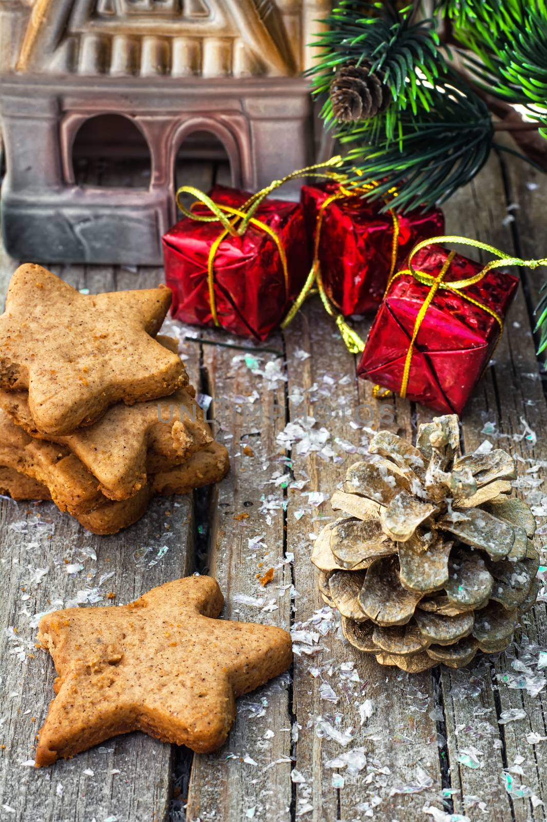 Christmas decorations and gingerbread cookies on wooden table .Photo tinted.