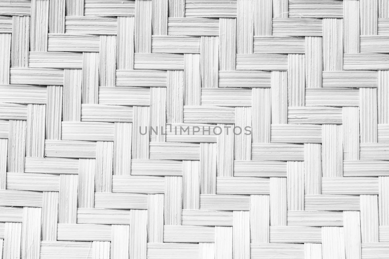 Texture of handmade basket in black and white color . made from bamboo . use for background