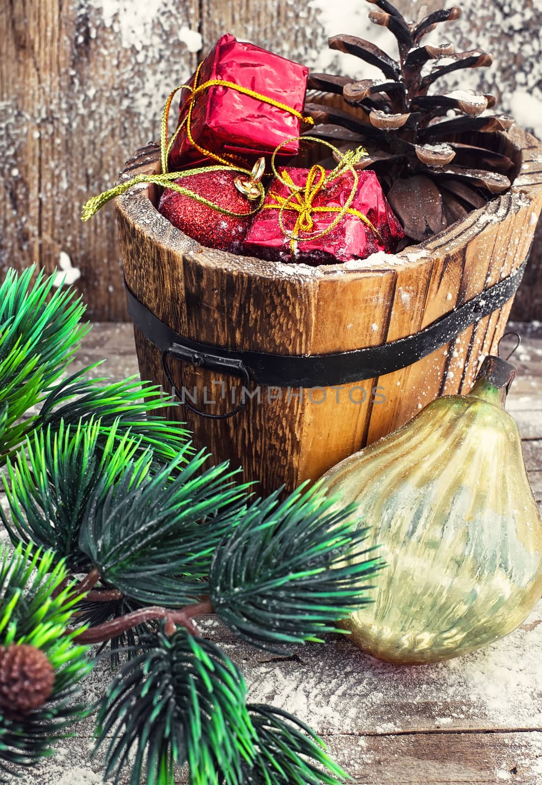 wooden tub with pine cones and Christmas decorations and ornaments.Selective focus