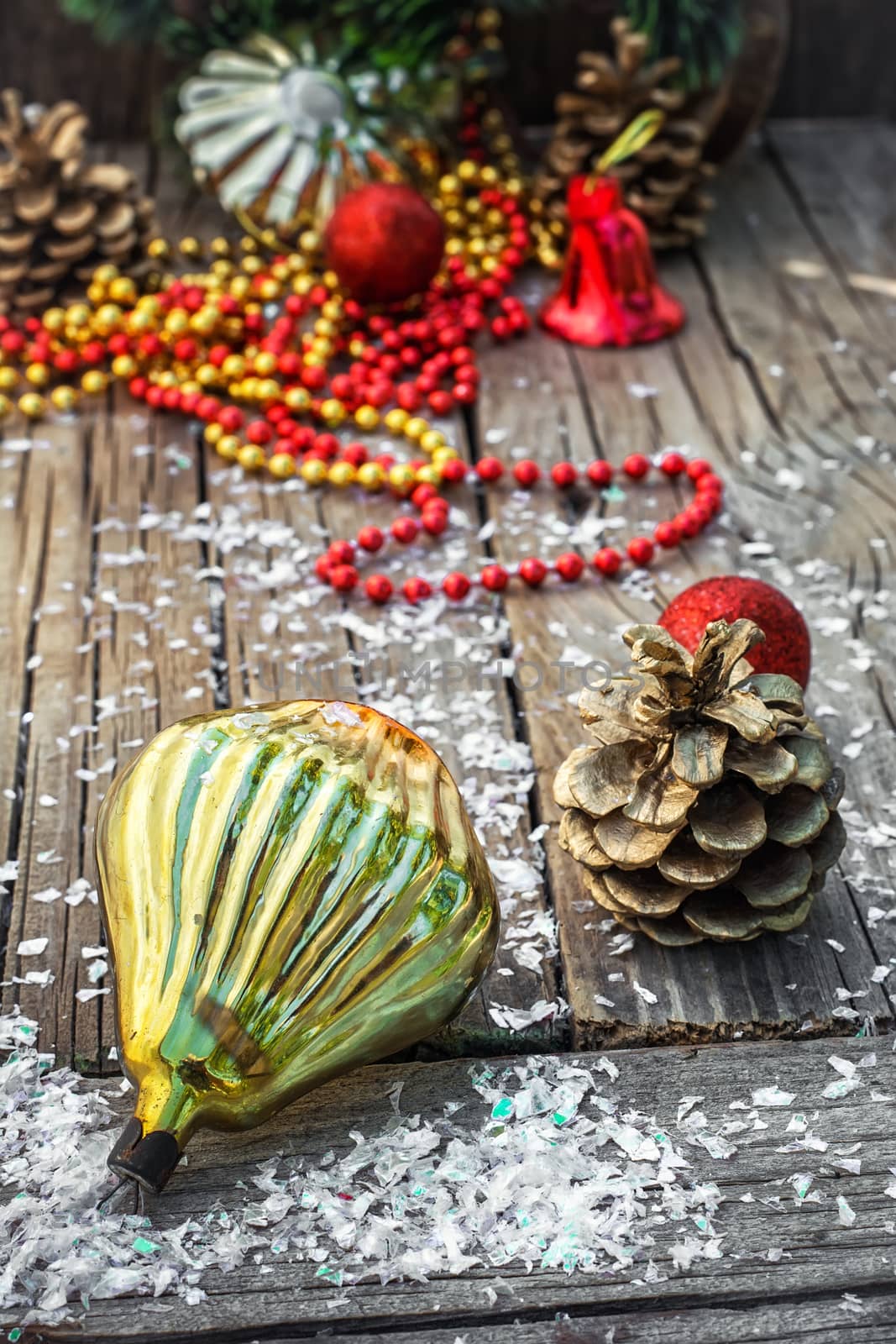 Christmas decorations from pine cones,toys on wooden background.Photo tinted