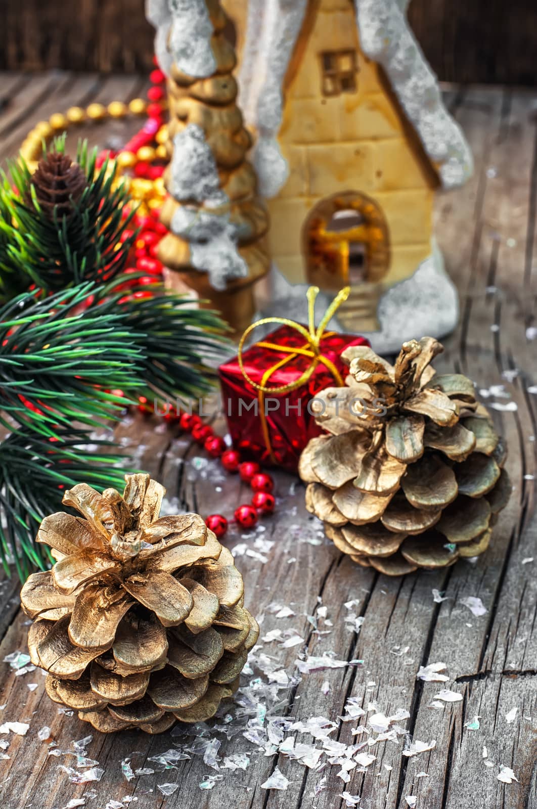 Christmas decorations from pine cones,toys on wooden background.Photo tinted