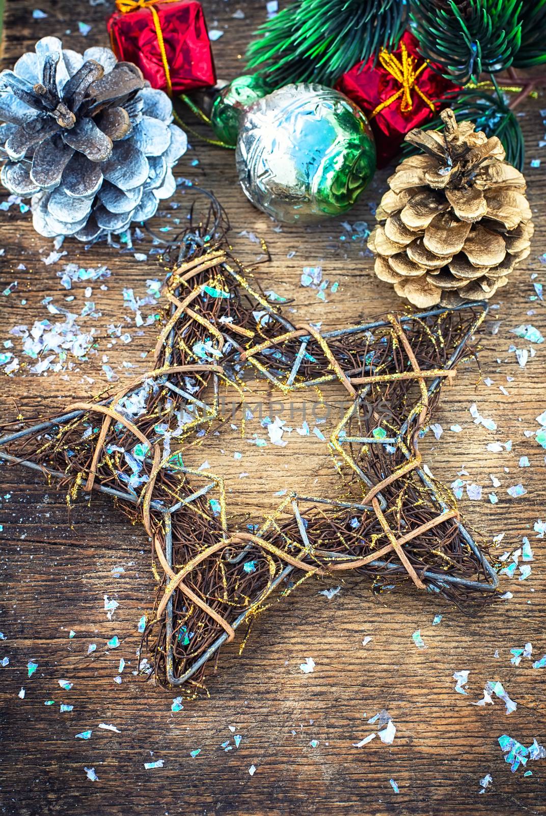 Traditional Christmas decorations of balls and cones on wooden table in vintage style.Selective focus