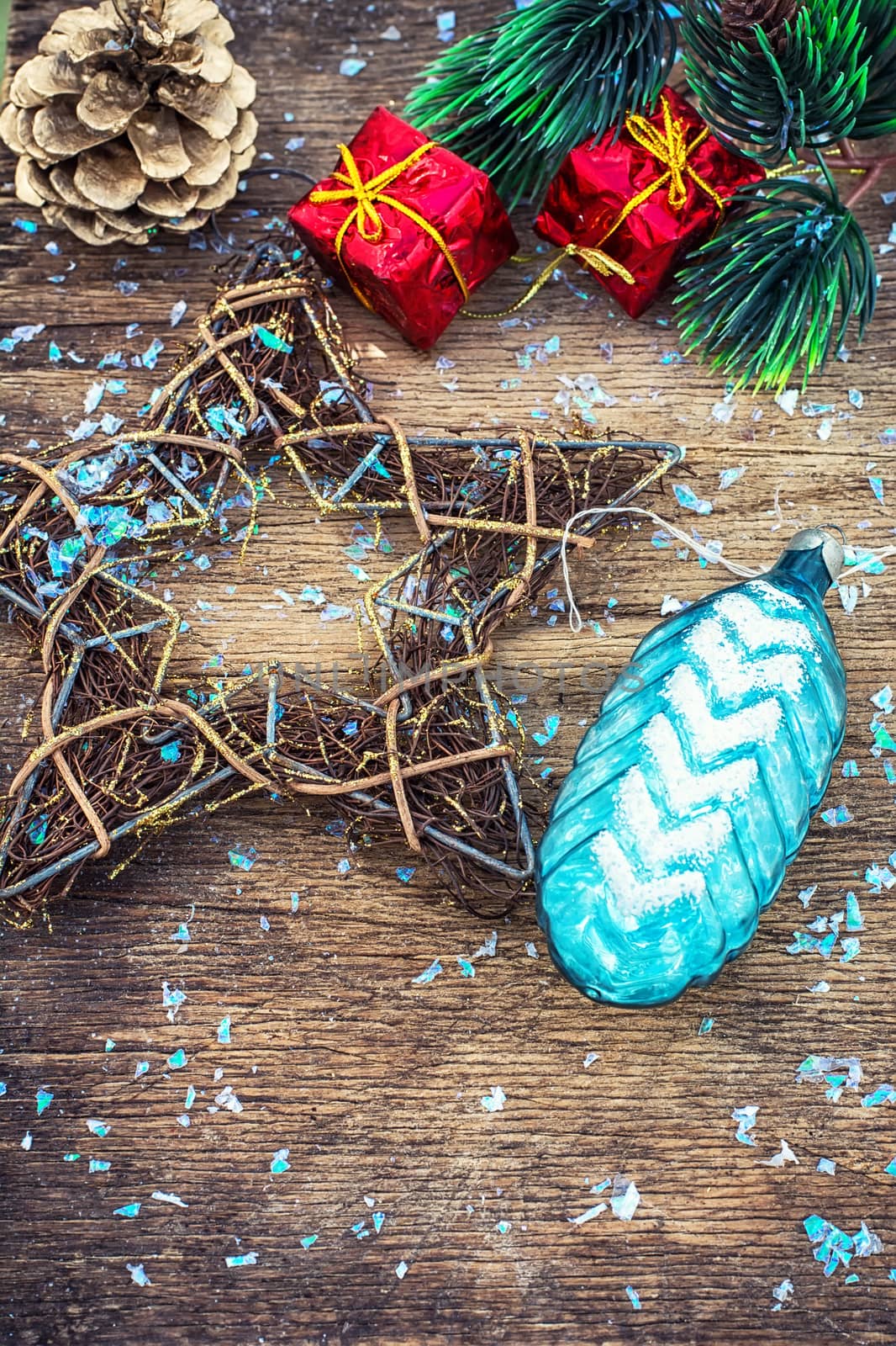 Festive Christmas decorations on wooden background in vintage style.Photo tinted.