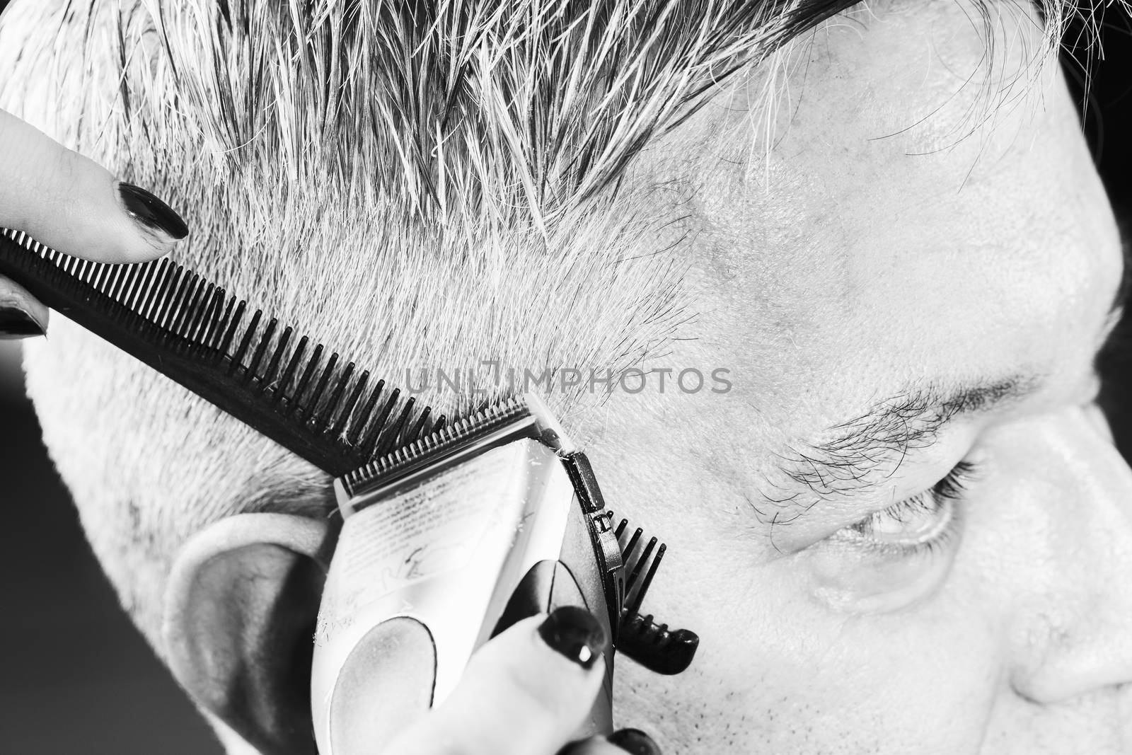 hairdresser cuts hair by CatherineL-Prod