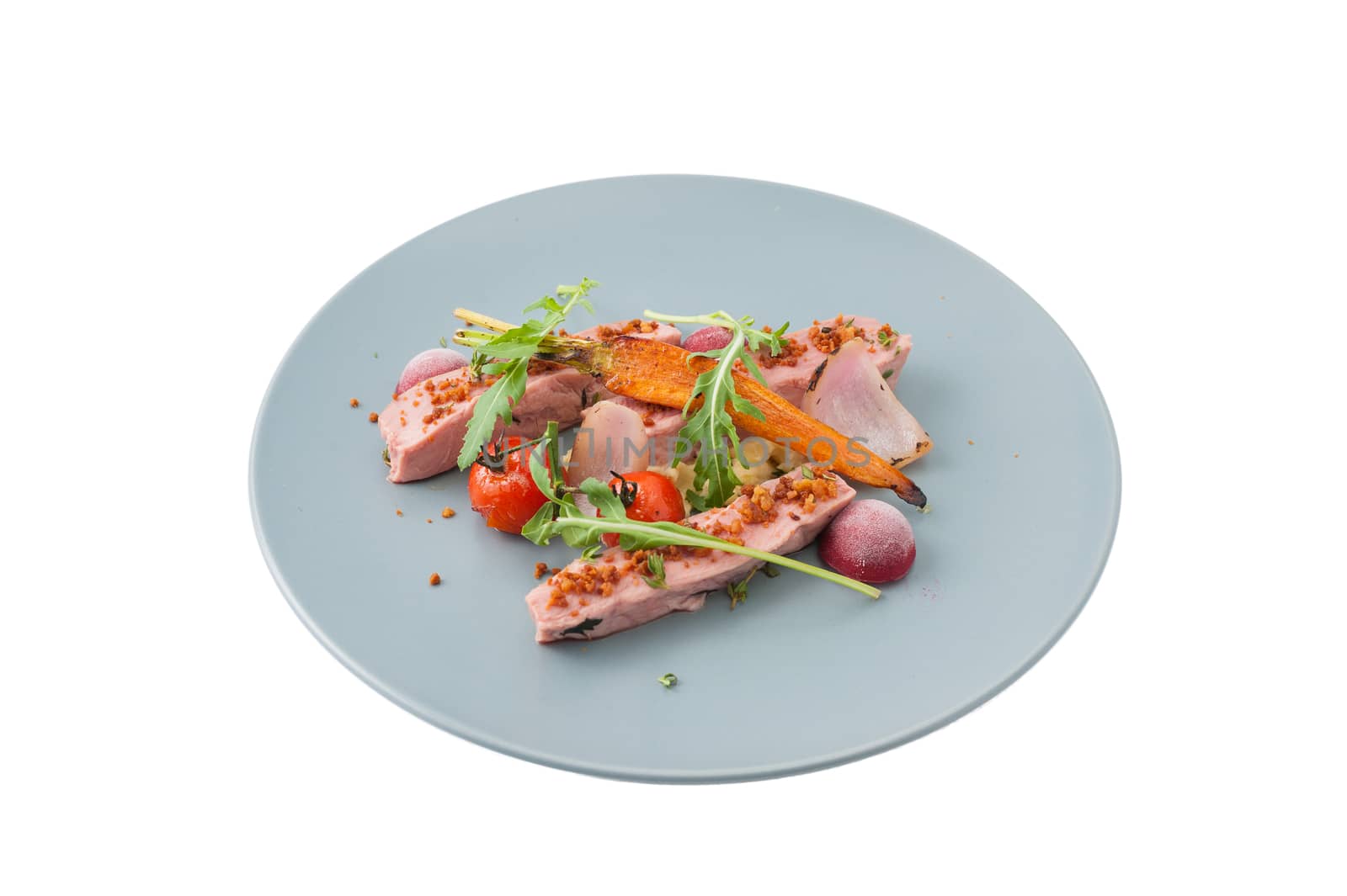 Roasted duck breast in modern cuisine style with vegetable and herbs isolated on white background with clipping path