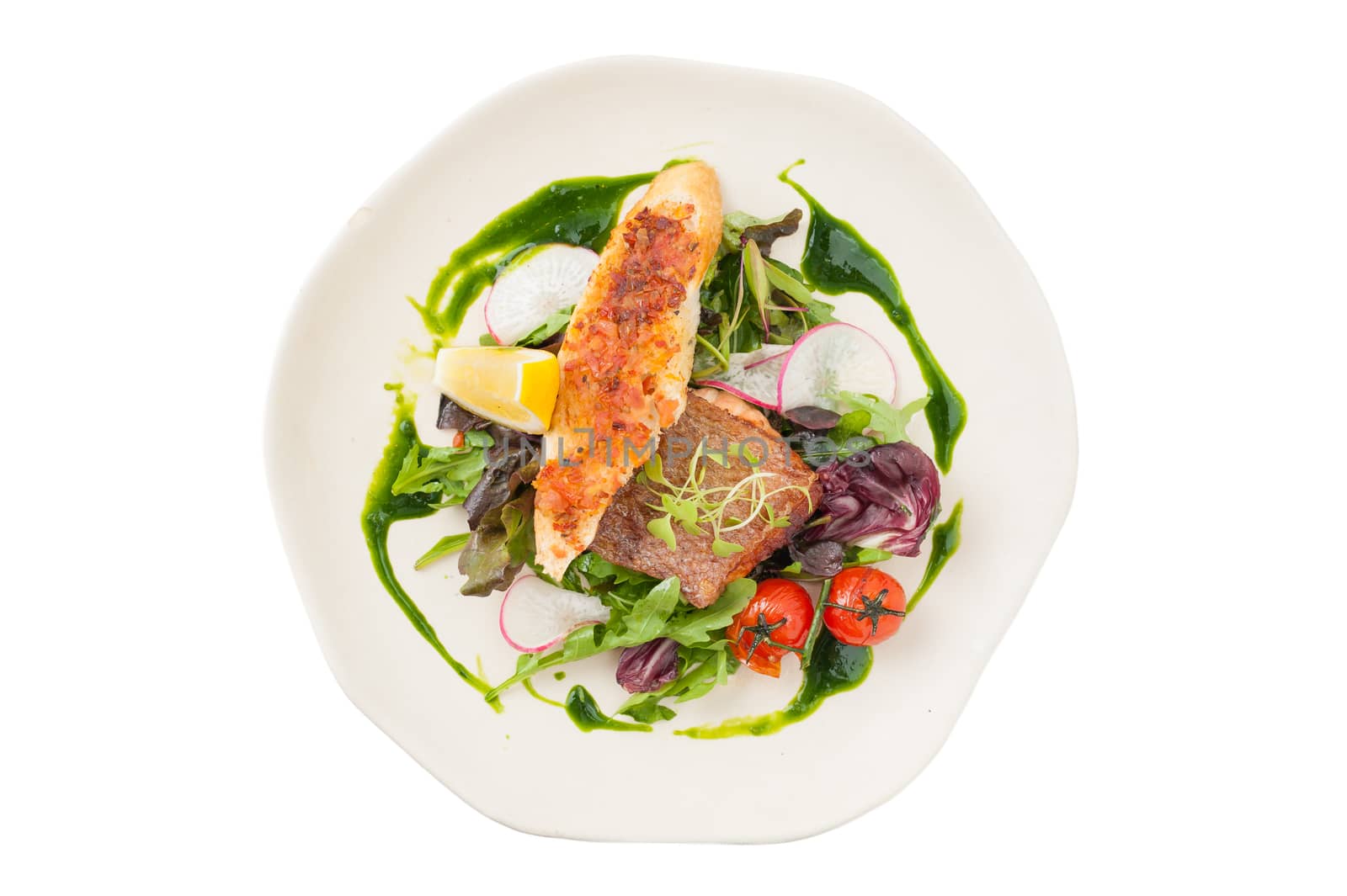 Modern style clean food, grilled salmon with toast and salad dressed with green sauce isolated on white background with clipping path