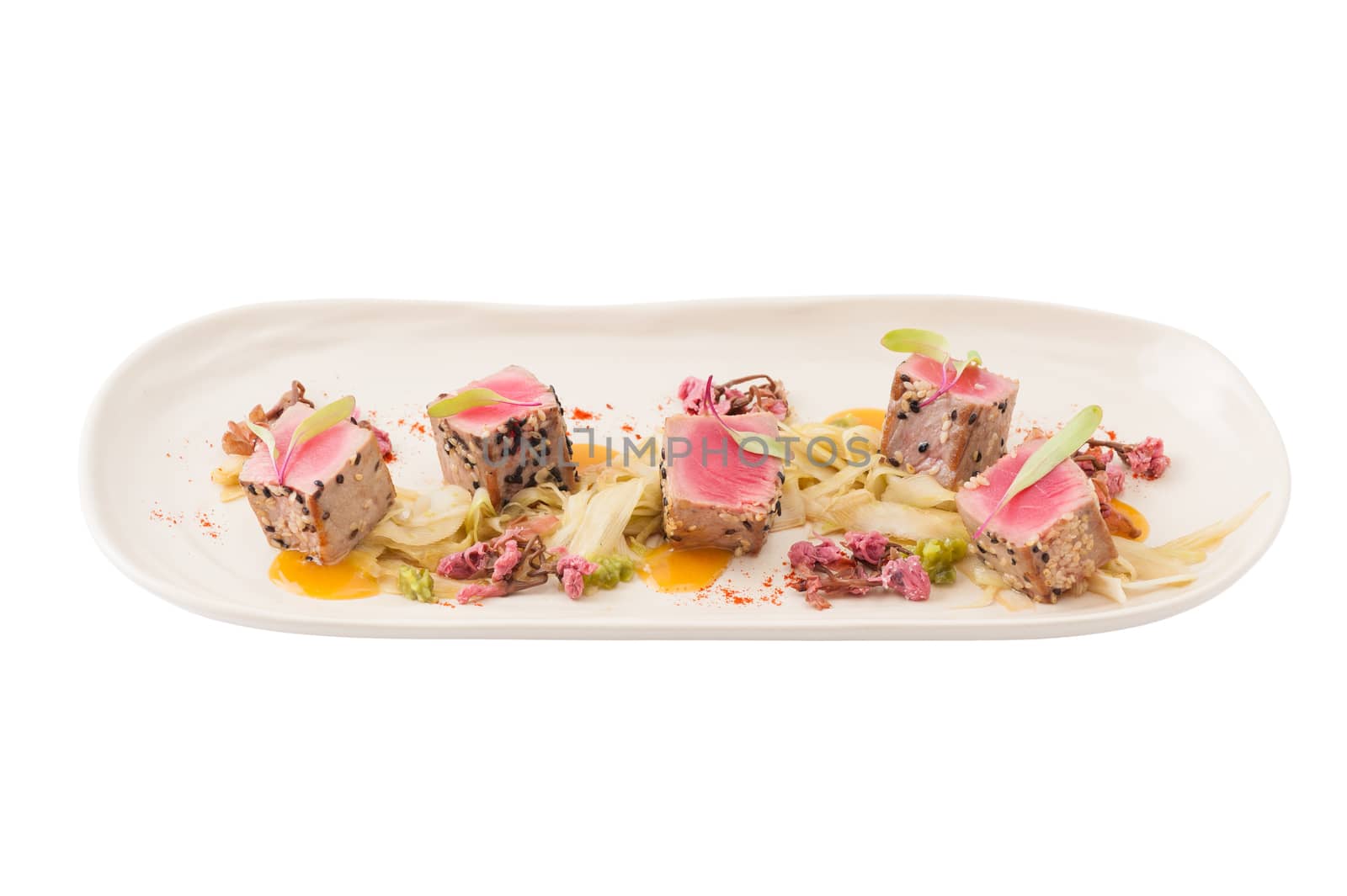 Modern style Japanese food, Burned tuna with herbs isolated on white background with clipping path