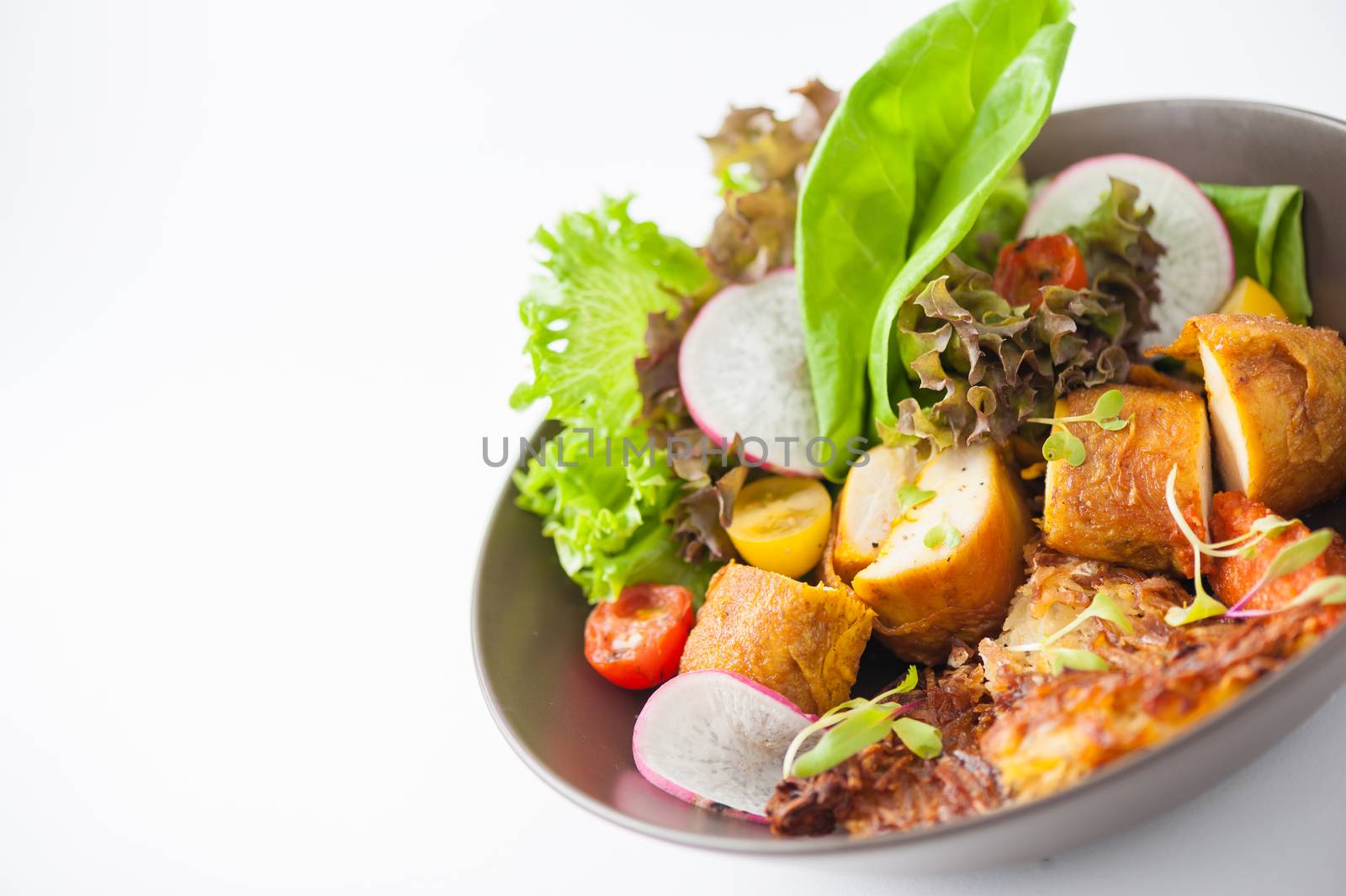 Chicken breast wrapped with vegetables and hash brown in clean food concept