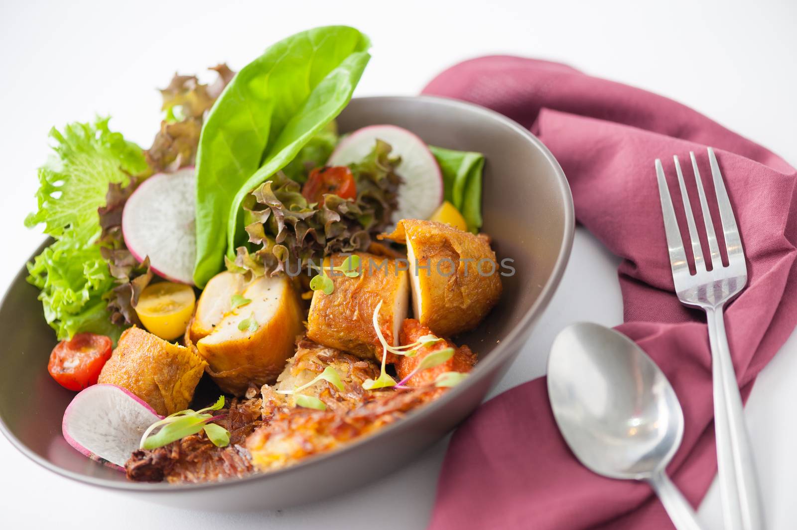 Chicken breast wrapped with vegetables and hash brown in clean food concept