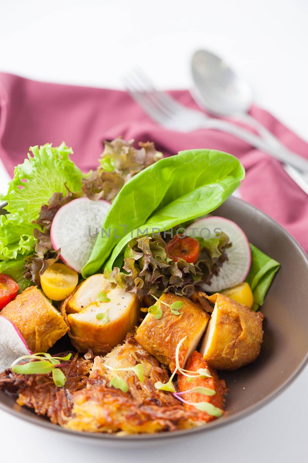 Chicken breast wrapped with vegetables and hash brown in clean food concept