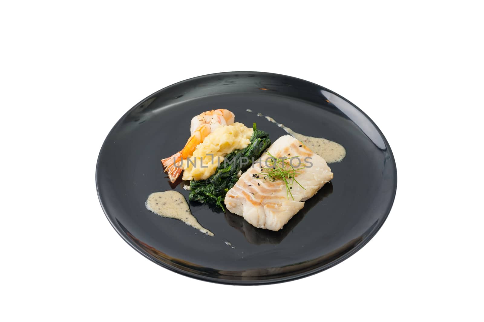 Cod fish steak with shrimp, mesh potato, and vegetable, modern style food isolated on white background with clipping path