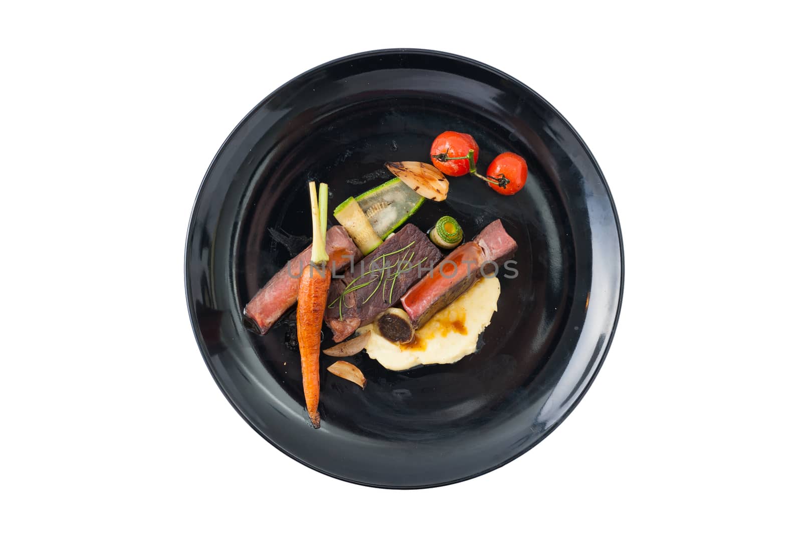 Dry-aged beef steak with mesh potato and vegetable, a modern style food isolated on white background with clipping path