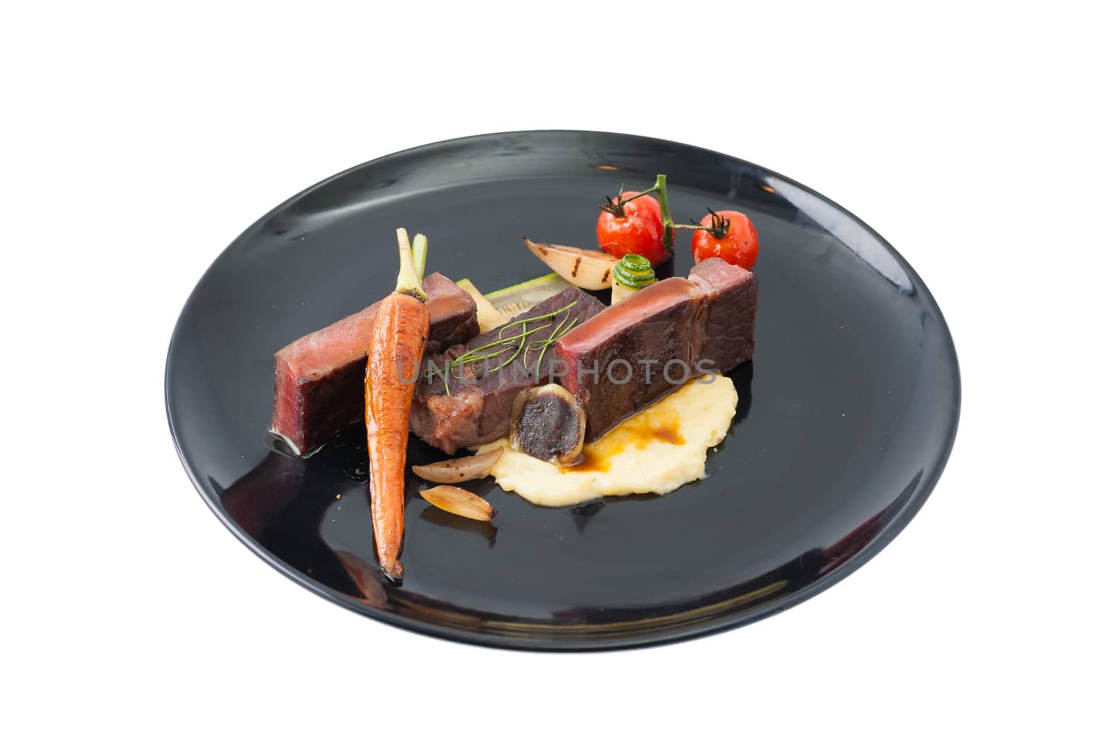 Dry-aged beef steak with mesh potato and vegetable, a modern style food isolated on white background with clipping path