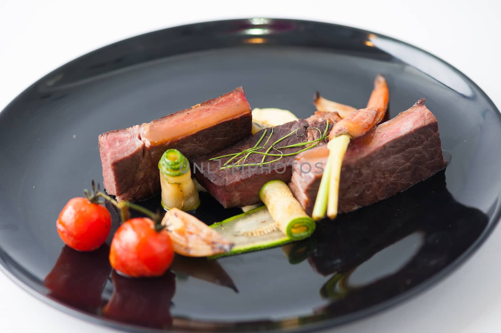 Dry-aged beef steak with mesh potato and vegetable, a modern style food