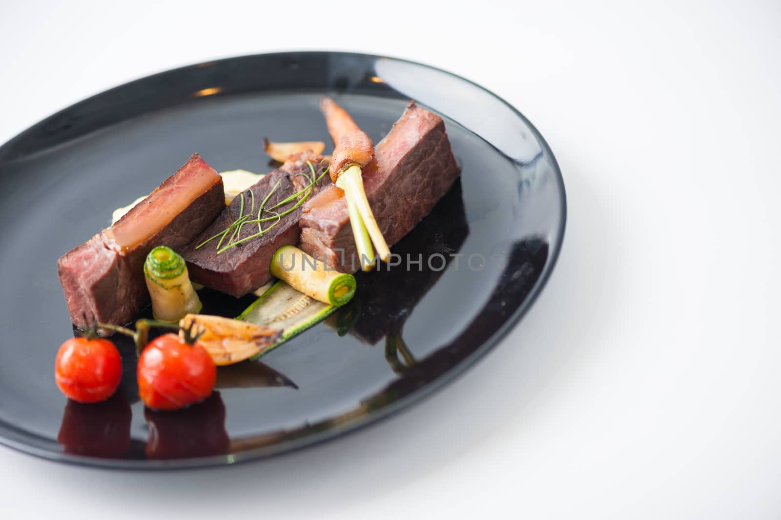 Dry-aged beef steak with mesh potato and vegetable, a modern style food