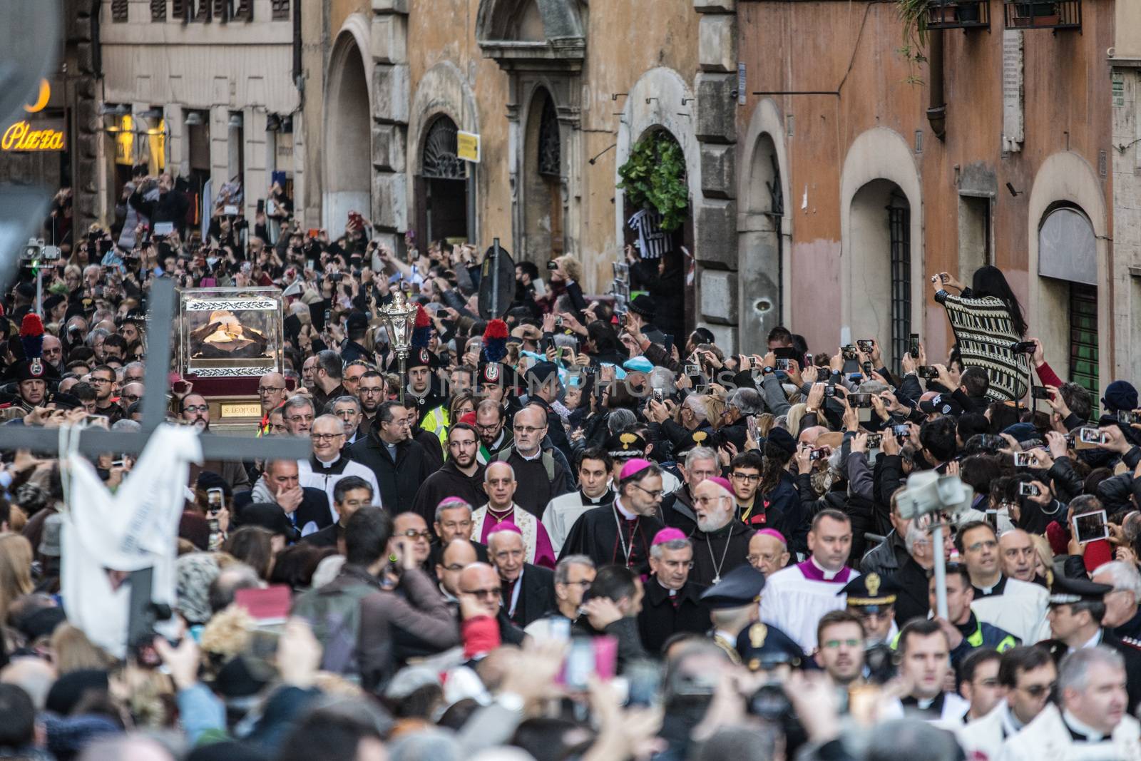 ITALY, Rome: An estimated 20,000 people march in a procession carrying the body of Padre Pio through Rome, Italy on February 5, 2016, as Pope Francis' Extraordinary Jubilee of Mercy continues. The procession honors Padre Pio and St. Leopold Mandic, as their bodies are carried from the church of San Salvatore in Lauro, to St. Peter's Basilica at the Vatican. Padre Pio's body arrived in Rome for the first time this week, where it will remain until next week for a series of Masses, vigils, and events at a number of Roman churches.