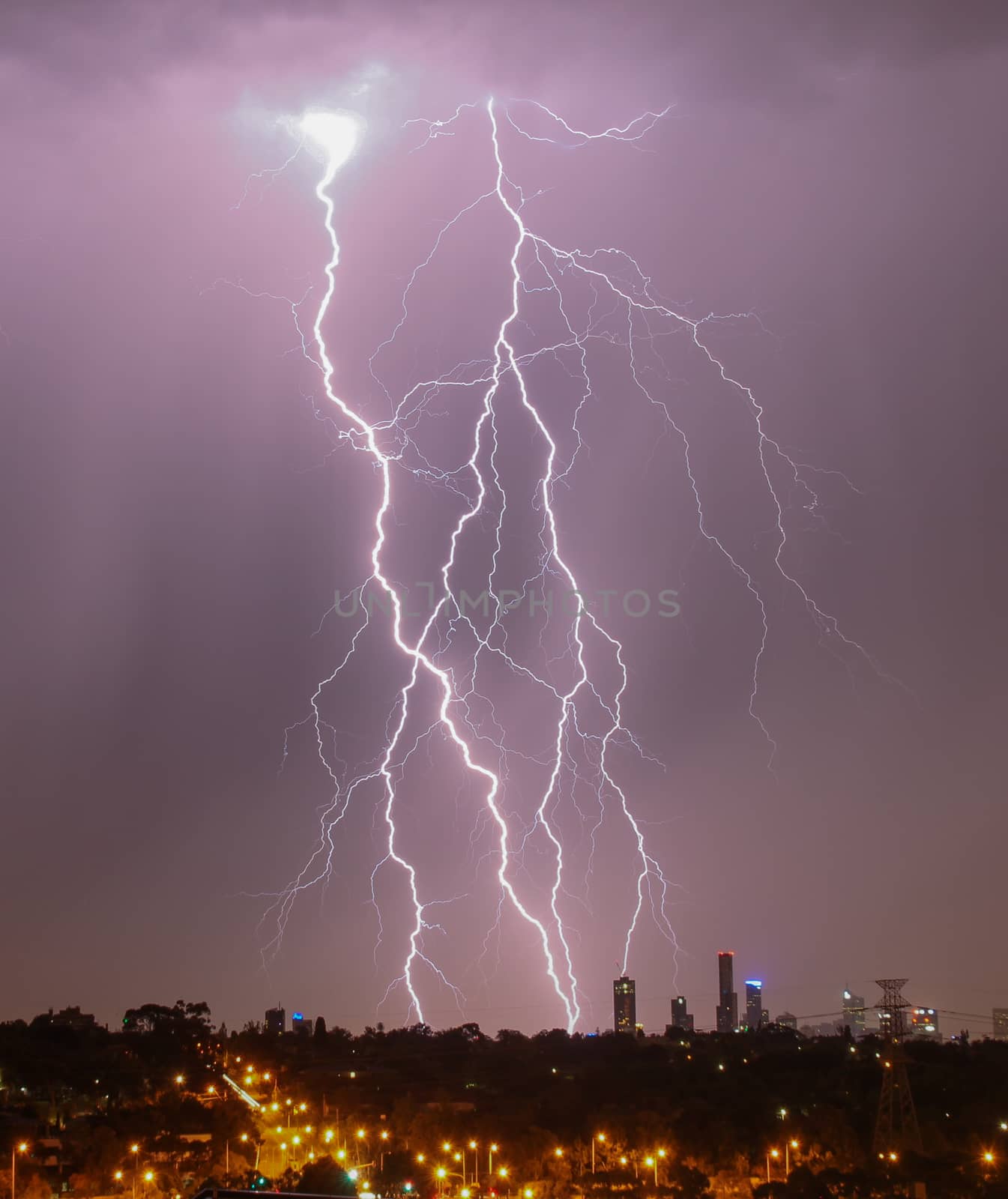 Lightning over city skyline by danieldep