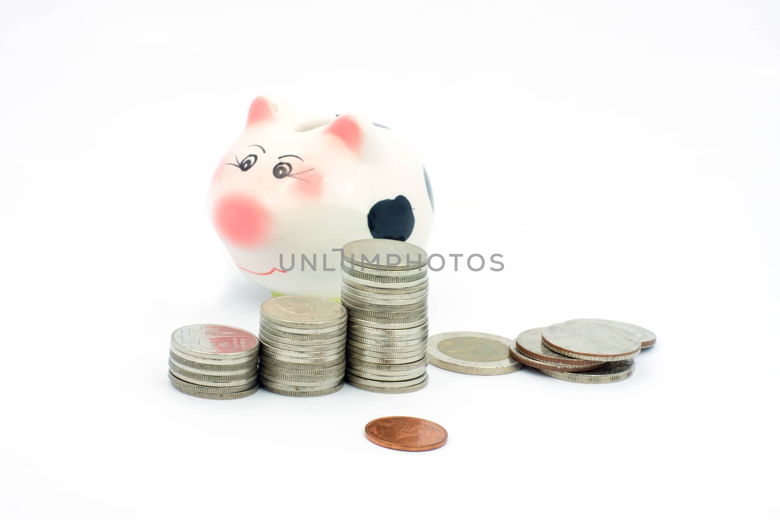 Thai stack coins with piggy bank on white background, financial concept photo