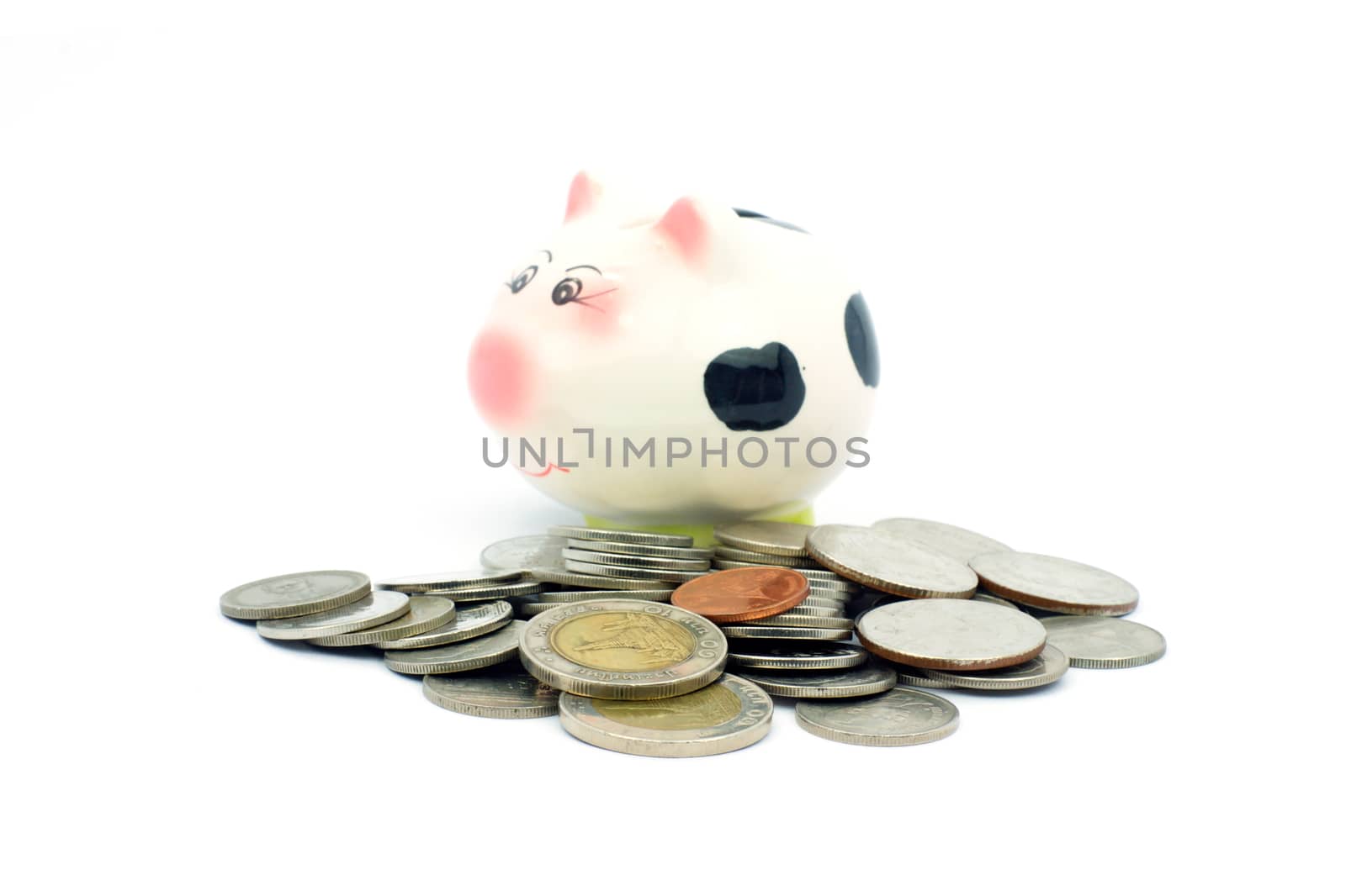 Thai stack coins with piggy bank on white background, financial concept photo