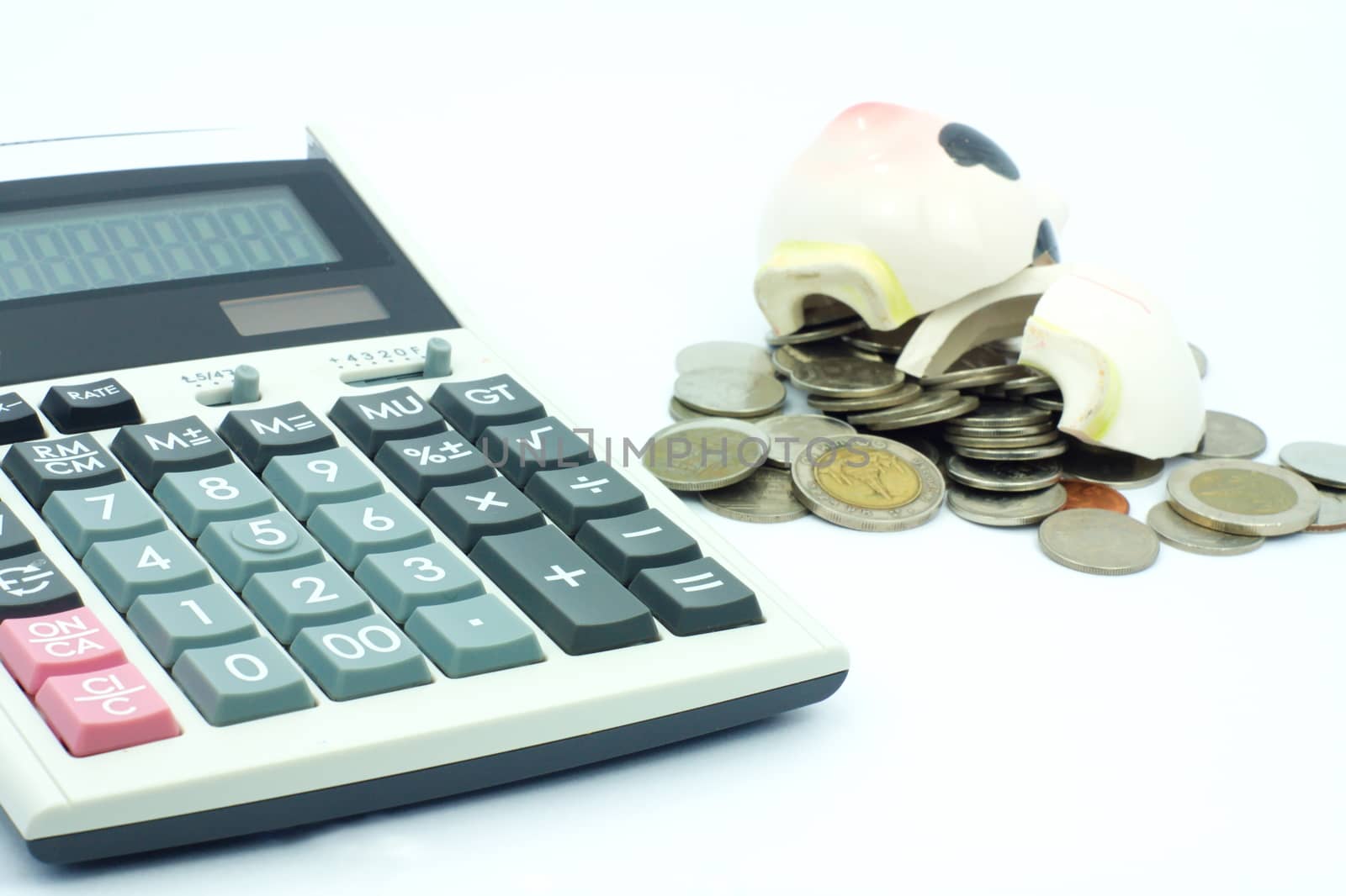 Thai stack coins in financial concept on white background, broken piggy bank put on stack coins