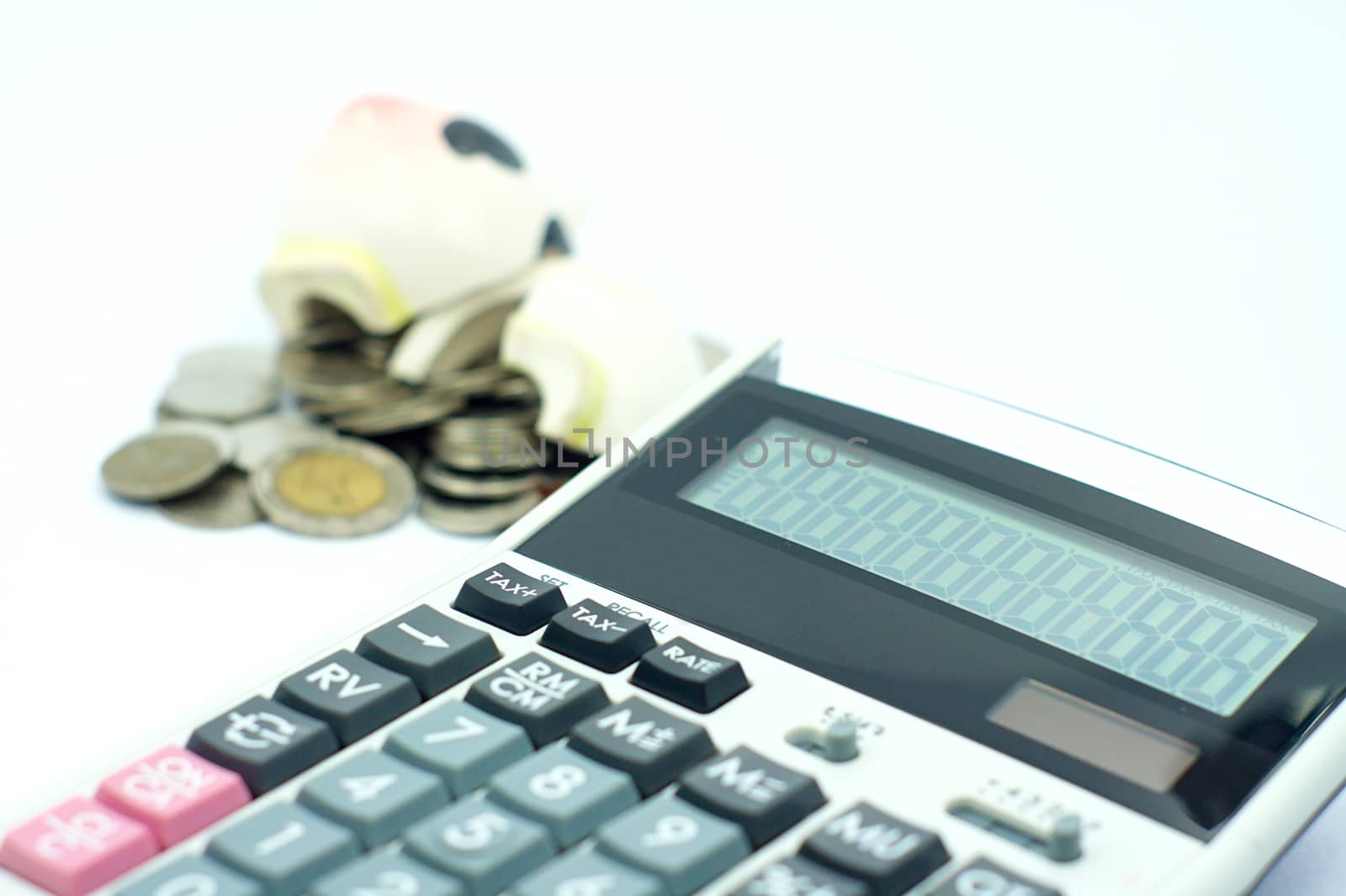 Thai stack coins in financial concept on white background, broken piggy bank put on stack coins