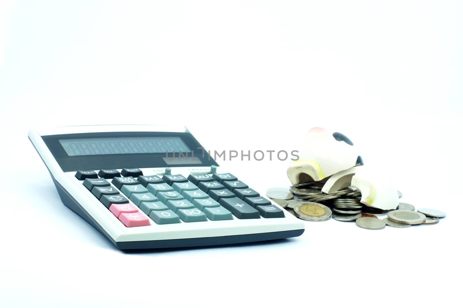 Thai stack coins in financial concept on white background, broken piggy bank put on stack coins