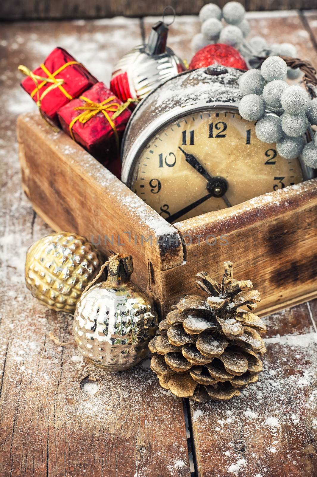 Old clock in  wooden box lined with Christmas decorations
