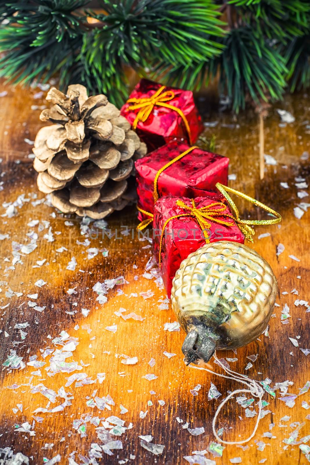 Christmas decoration for decorations on snowy wooden background.Photo tinted.