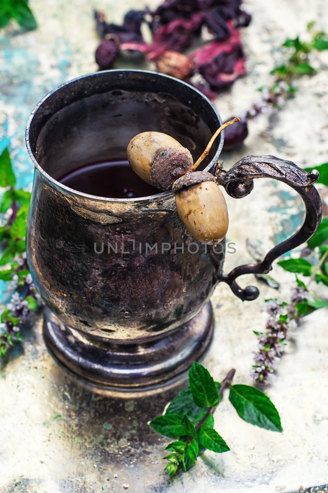 Herbal tea in iron stylish mug for medicinal herbs with fruit