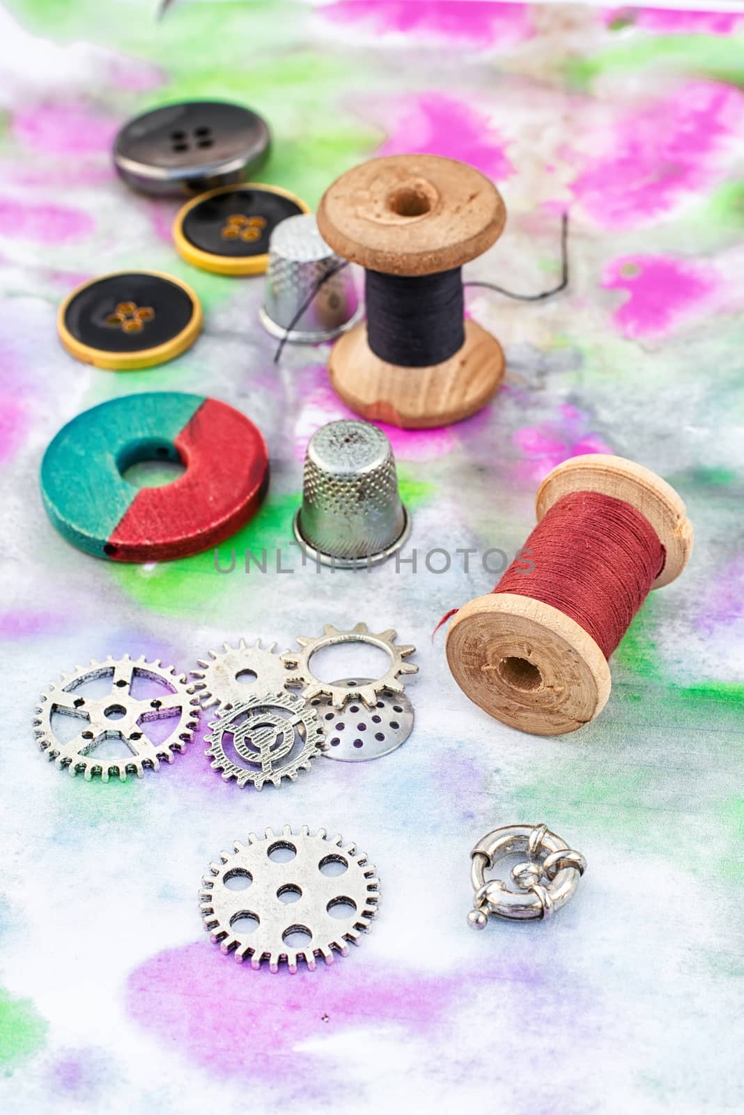 accessories of beads and threads for needlework on wooden plank