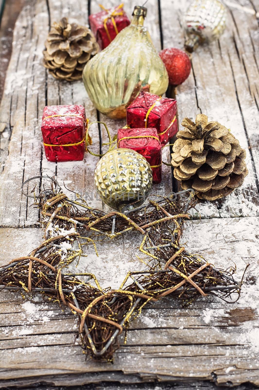 Christmas decoration for decorations on snowy wooden background.Photo tinted.