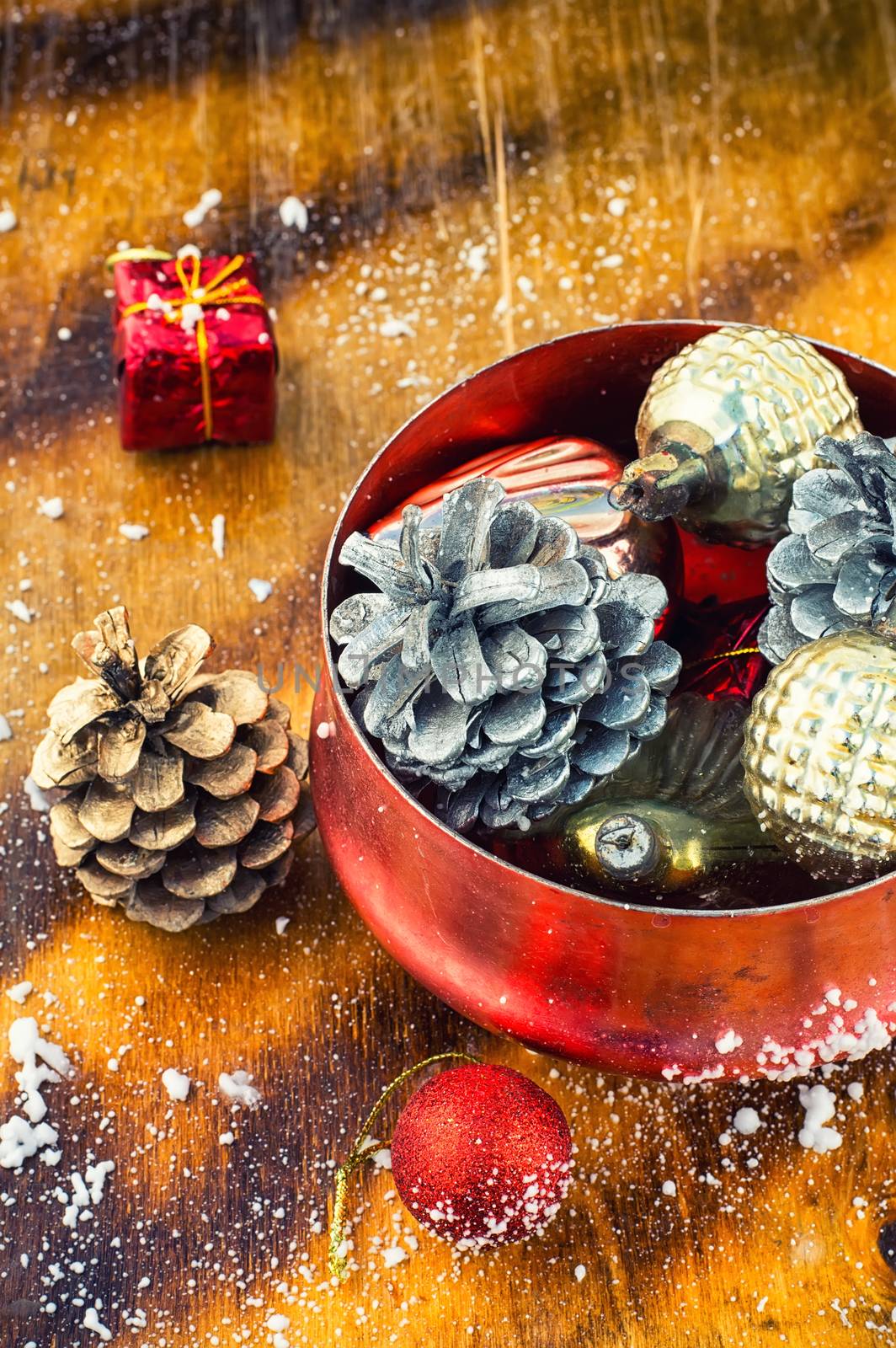 Christmas decoration for decorations on snowy wooden background.Photo tinted.