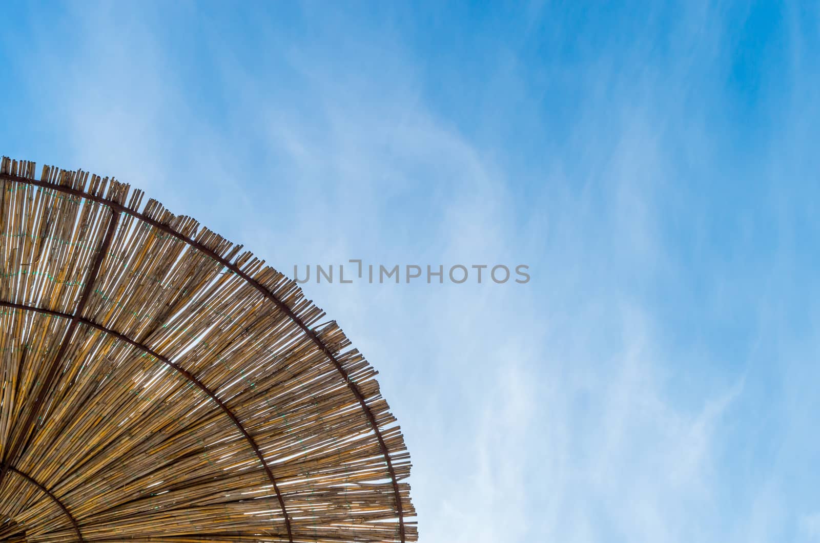Wooden parasol and the sky 