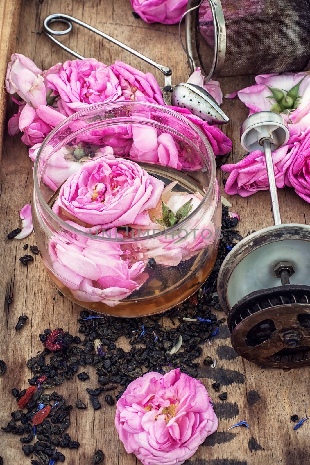buds of the tea roses in wooden box with welding in rustic style