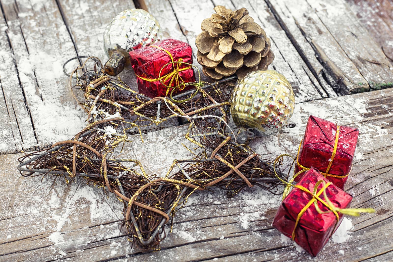 Christmas decorations with red boxes on wooden background 