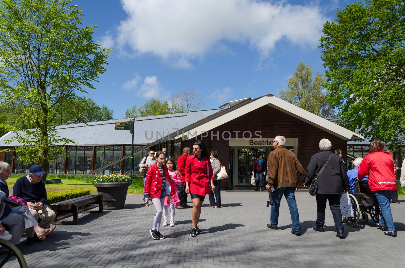 Lisse, The Netherlands - May 7, 2015: Tourists visit famous garden in Keukenhof on May 7, 2015. Keukenhof is the most beautiful spring garden in the world.