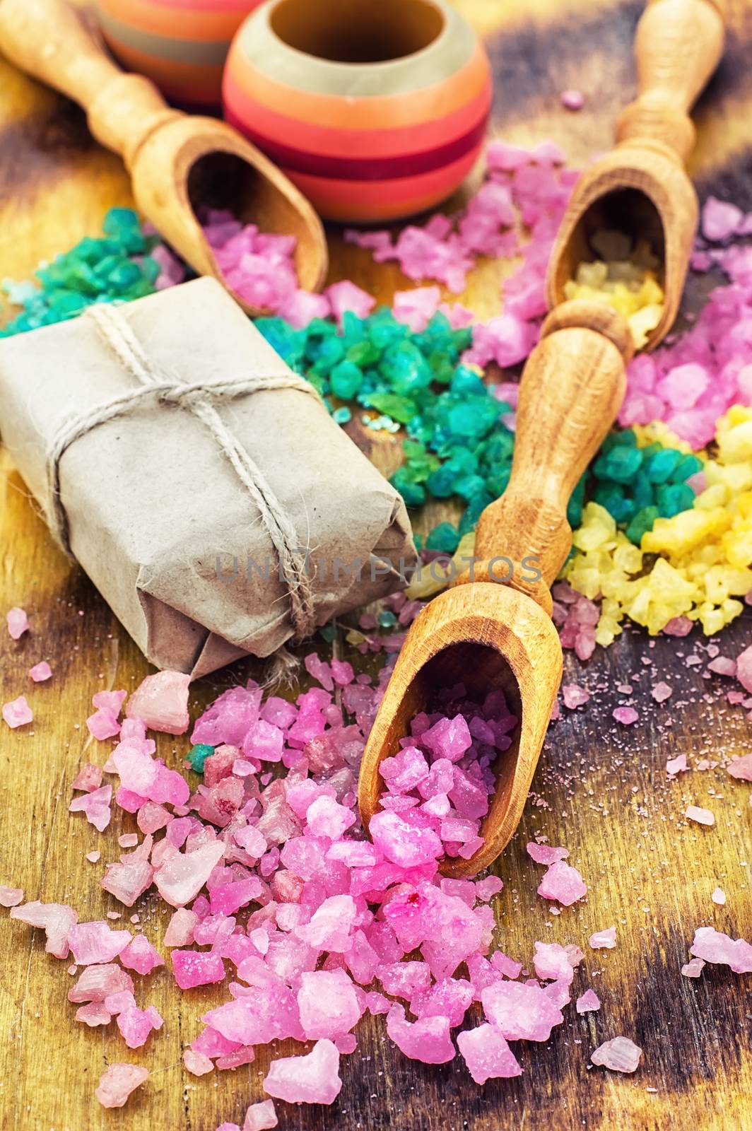 Sea salt for Spa relaxation treatments on the background of wooden scoops