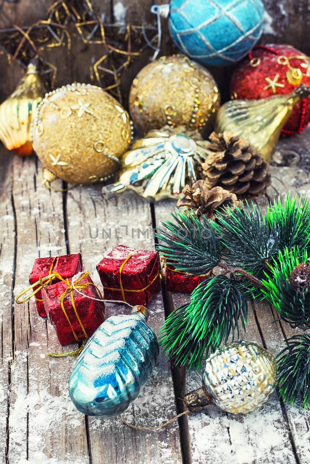 Christmas decoration for decorations on snowy wooden background.Photo tinted.