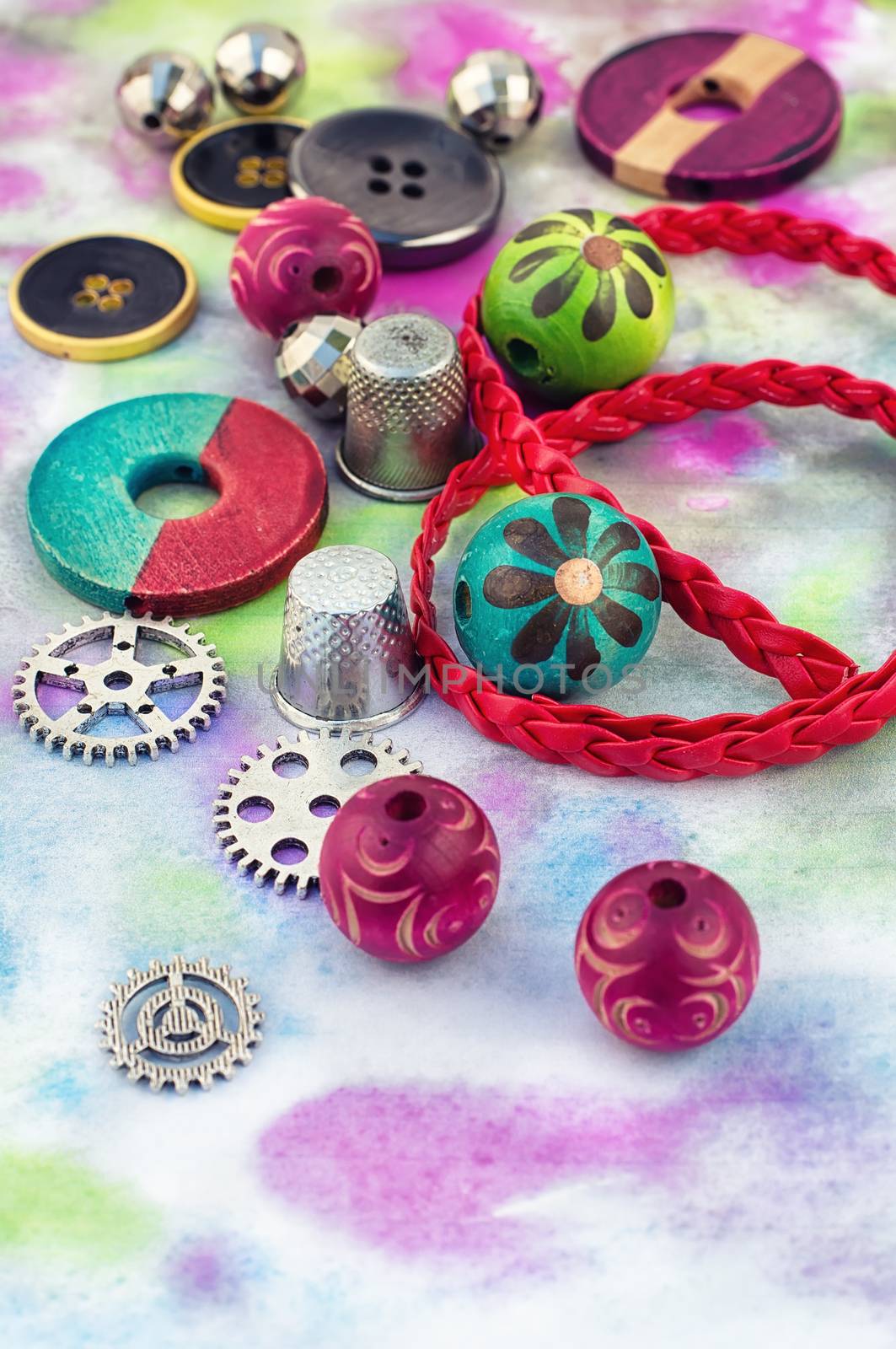 accessories of beads and threads for needlework on wooden plank