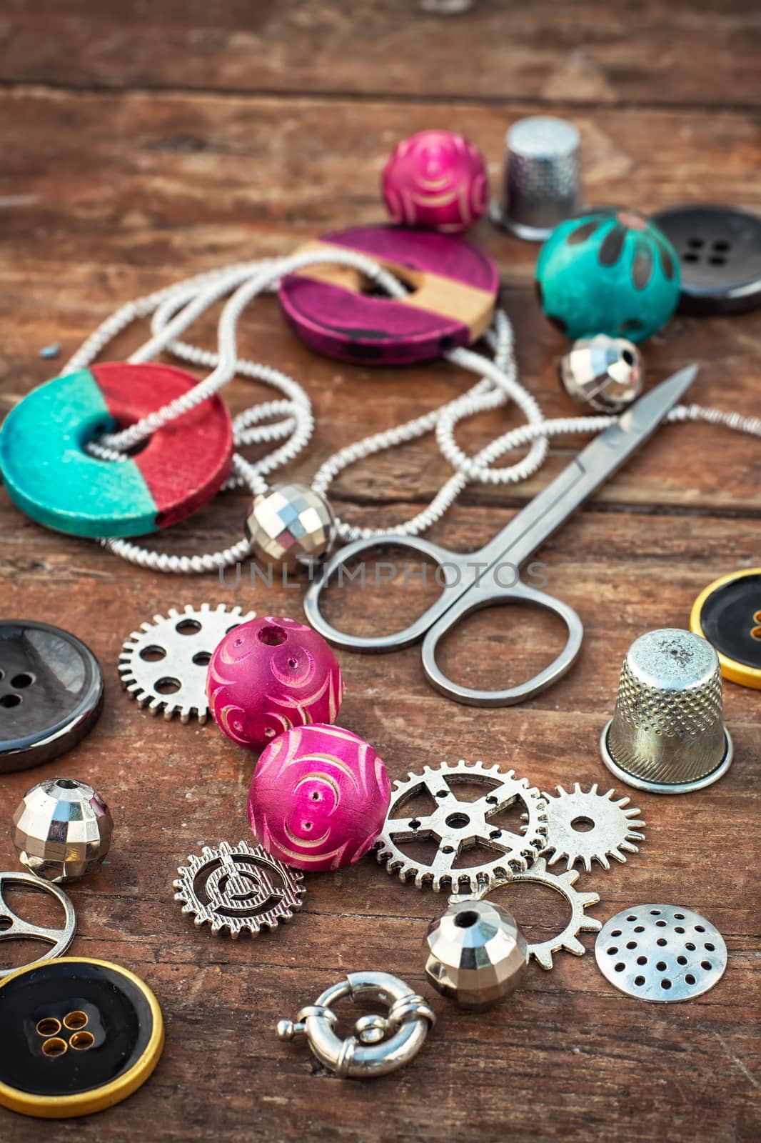 beads and jewelry for handmade on light orange plate