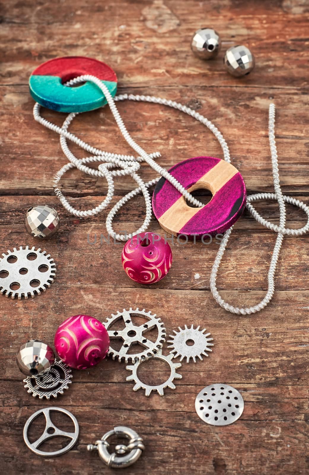 beads and jewelry for handmade on light orange plate