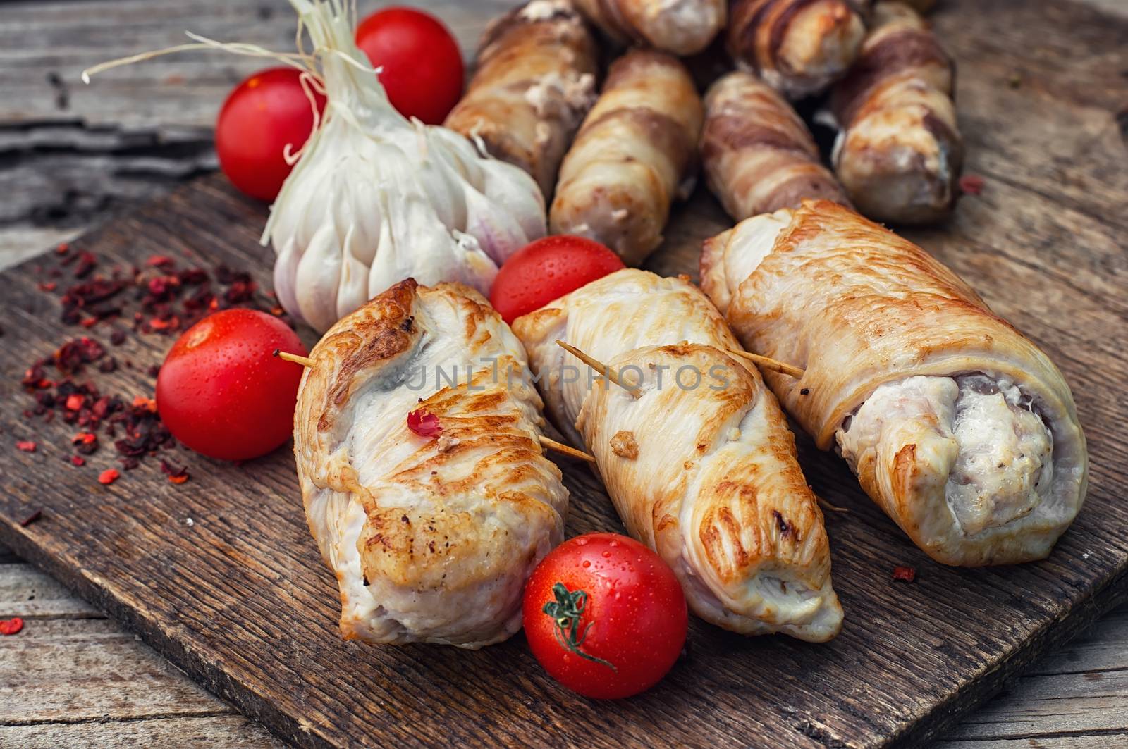 Set of rolled into tube of sausage meat in rustic style