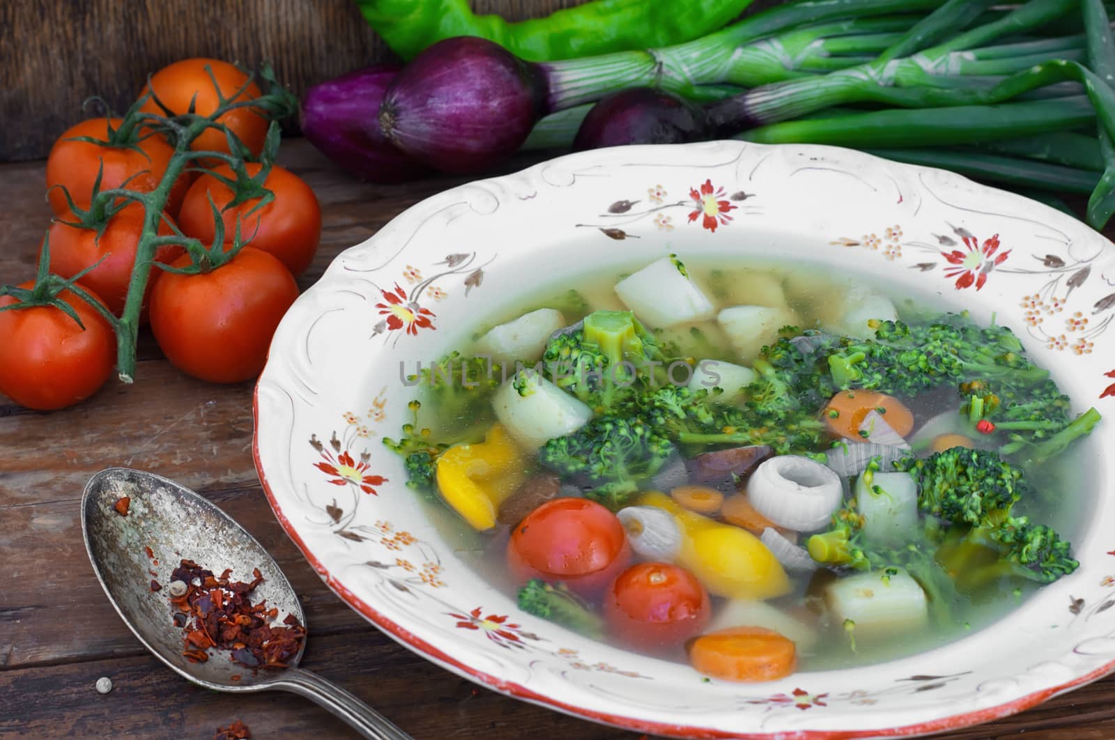 Big bowl of vegetable soup seasoned with hot spices.