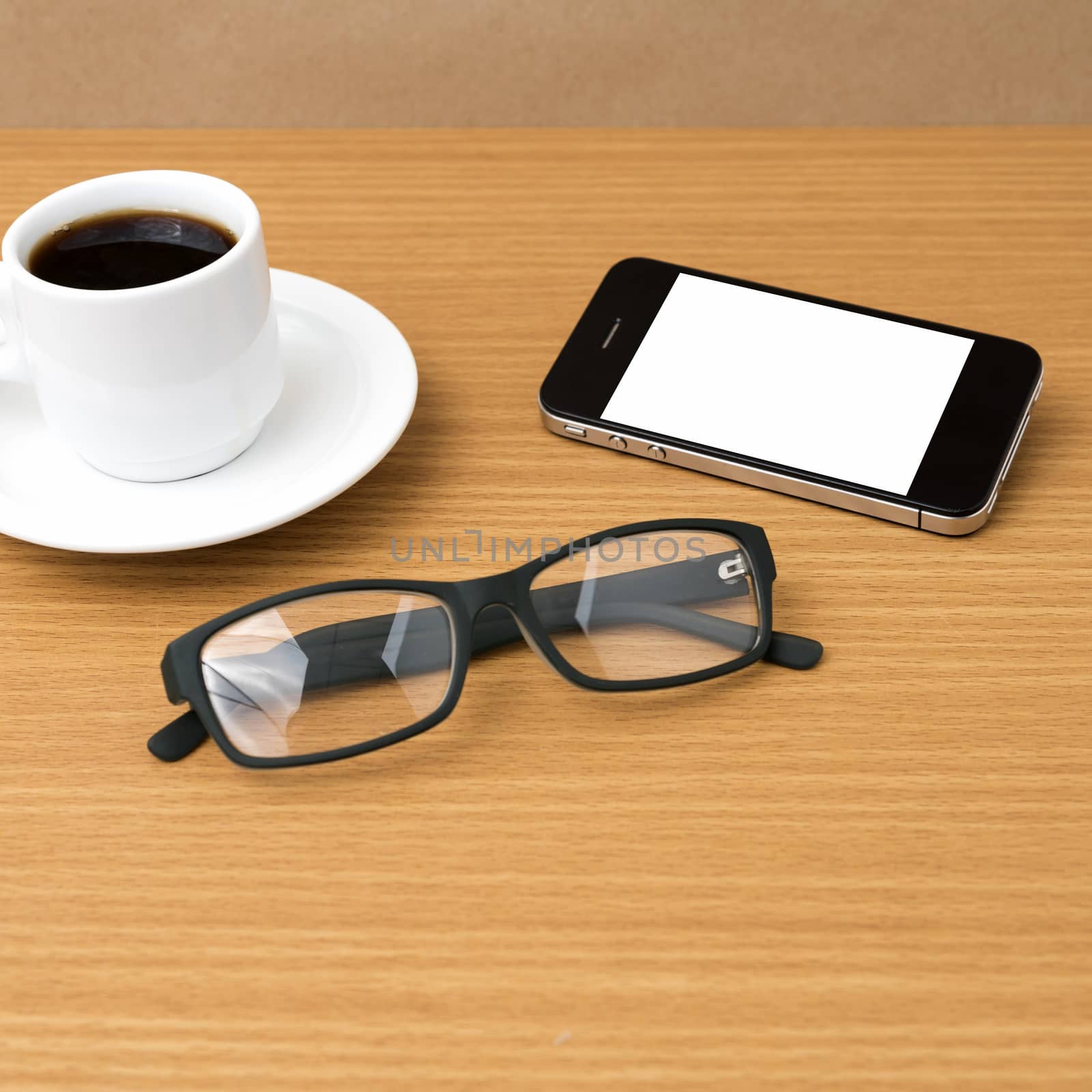 coffee cup and phone and eyeglasses on wood background