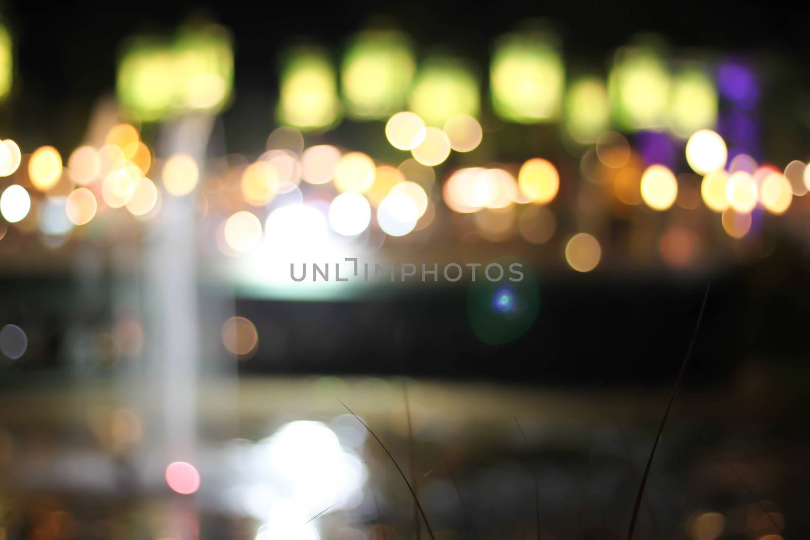 Blurred background bokeh night with a fountain. by primzrider