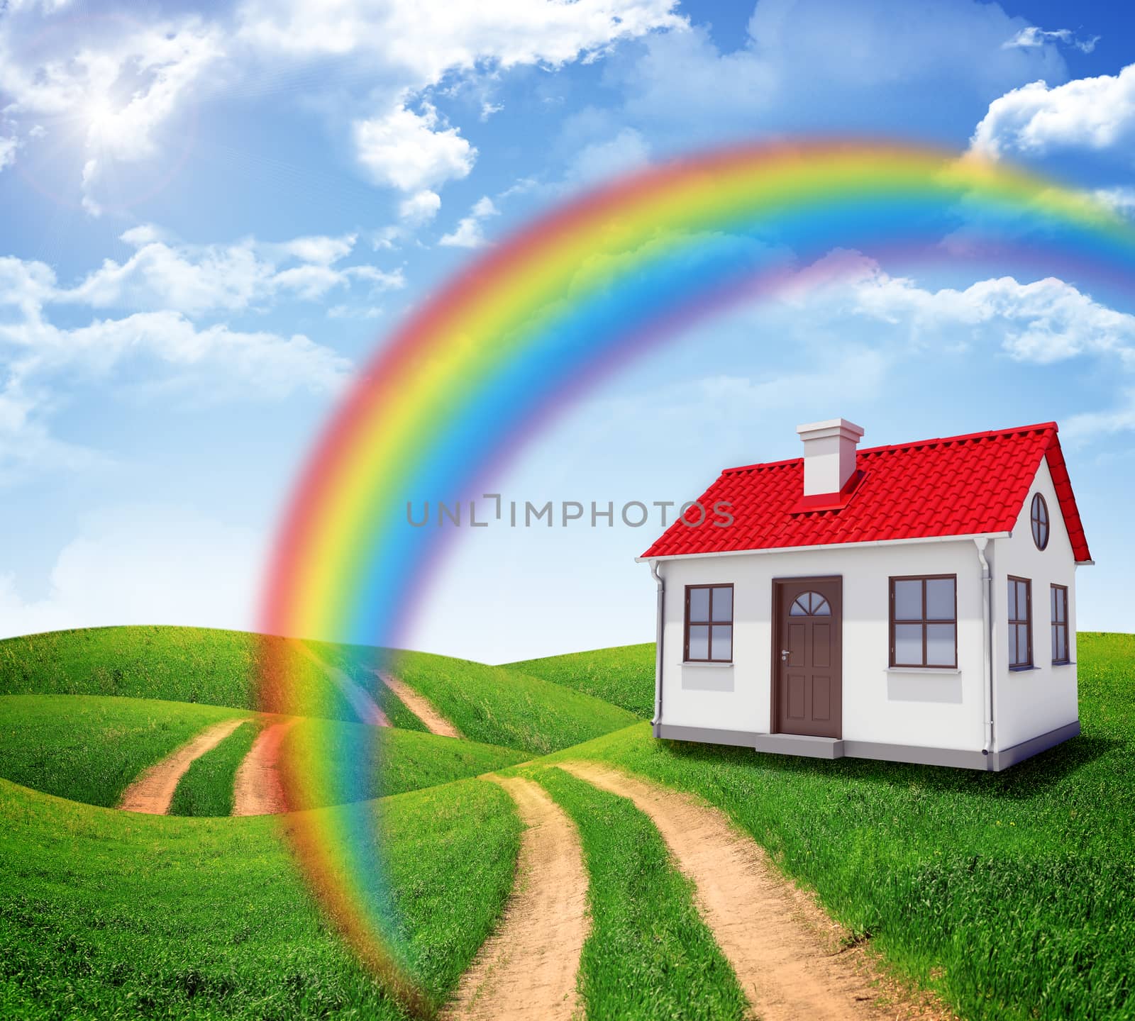 House in green field with rainbow and blue sky