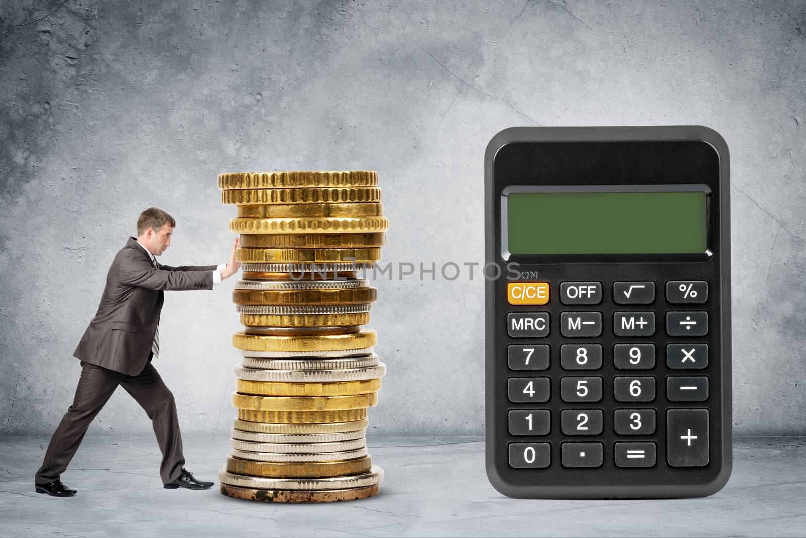 Businessman pushing pile of coins by cherezoff