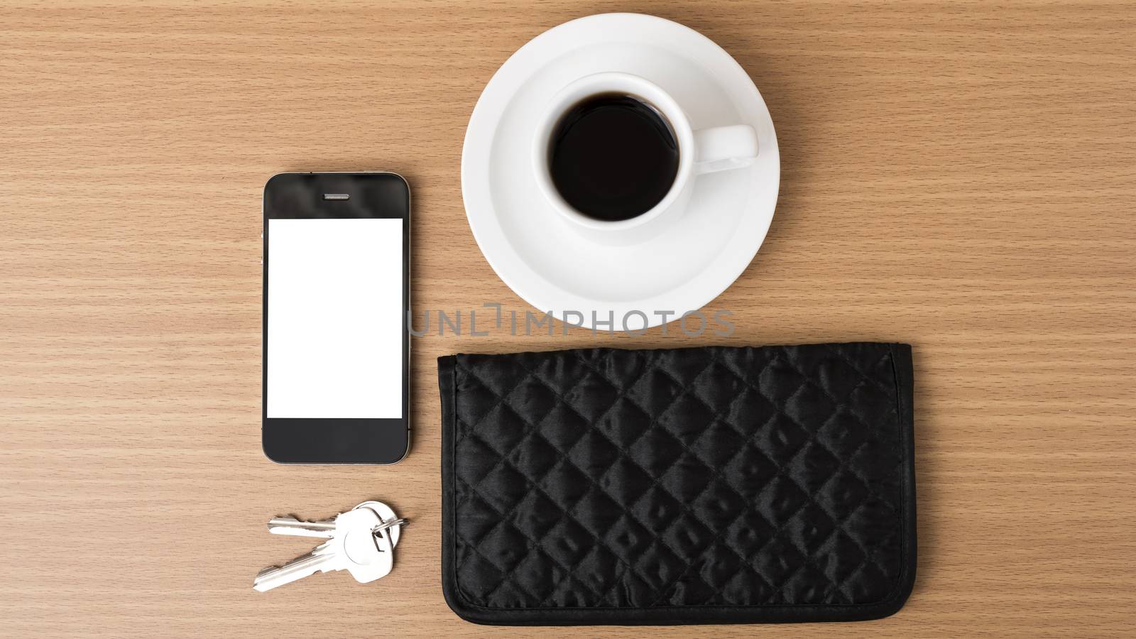 coffee phone key and wallet on wood table background
