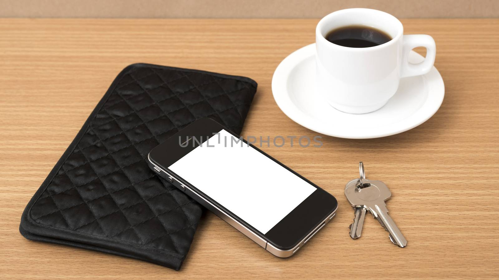 coffee phone key and wallet on wood table background