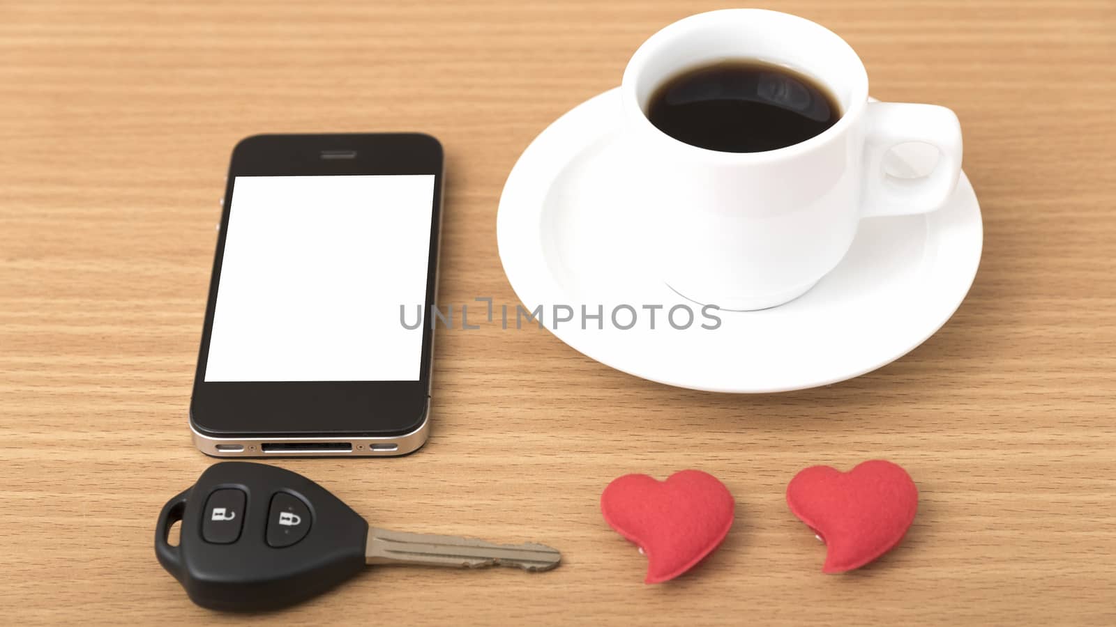coffee phone car key and heart on wood table background